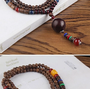 Detailed view of ethnic wooden bead necklace with colorful accent beads and a bodhi pendant