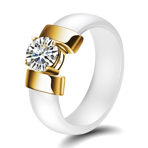 Modern 6mm white ceramic ring with gold metal base and round brilliant cut cubic zirconia