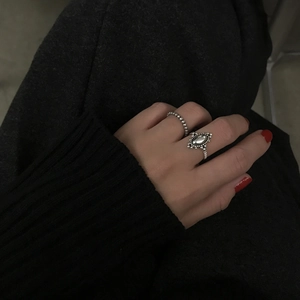 Close-up of vintage 925 sterling silver rings with beaded and oval embossed details