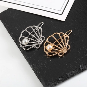 Hollow seashell hair clips in gold and silver metal with faux pearls for women