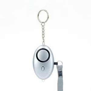 Silver egg-shaped personal safety alarm with LED flashlight and metal keychain loop