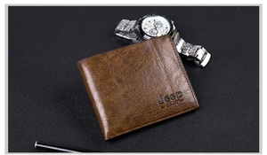 Close-up of brown textured leather wallet with embossed logo on a black surface