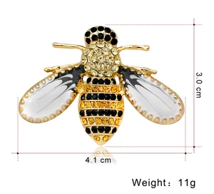 Detailed view of bee brooch showing white enamel wings and yellow rhinestone body dimensions
