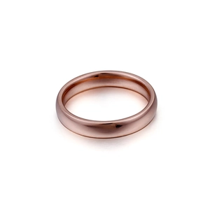 Minimalist rose gold plated titanium steel band ring with polished surface on white background