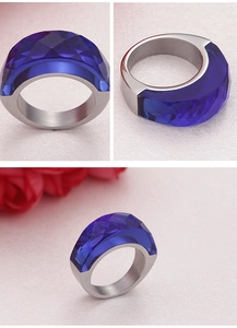 Detailed views of wide silver band ring with a faceted blue resin geometric stone