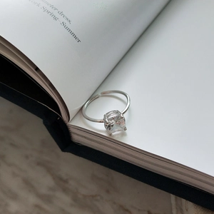 Macro detail of a square-cut solitaire zircon set on a S925 sterling silver ring