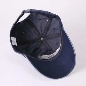 Deep blue washed cotton baseball cap featuring vintage 100% cotton inner structure