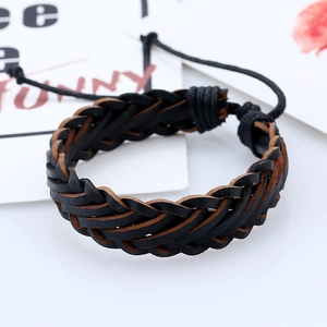 Detail of multi-layer woven black and brown leather bracelet with adjustable cords