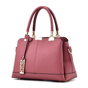 Pink lychee grain faux leather handbag with gold hardware and hollow metal charm