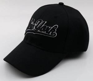 Detail of New York embroidery on black cotton baseball cap with twill texture