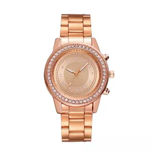 Macro shot of rose gold watch bezel set with crystals and textured dial detail