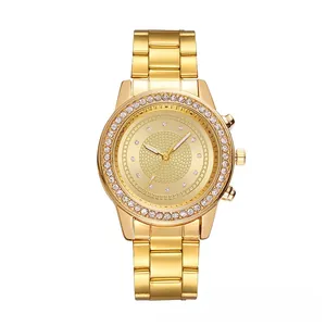 Close-up of a gold tone quartz watch with crystal bezel and luxury link bracelet