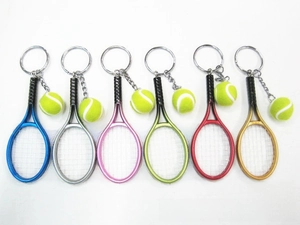 Detailed view of tennis racket keychains in six vibrant colors with mini fuzzy green balls
