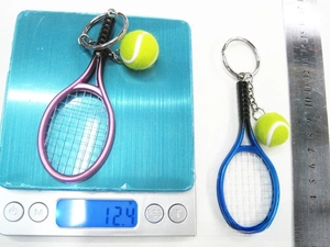 Mini tennis racket keychain weight and size measurement on scale and ruler