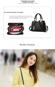 Detail of black litchi grain leather handbag with multi-layer interior and tassel charm