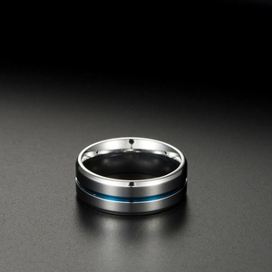 Close-up of silver titanium steel ring featuring a sleek blue center groove and polished finish