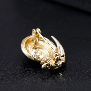 Vintage golden snail spiral brooch with polished finish for sweaters and scarves