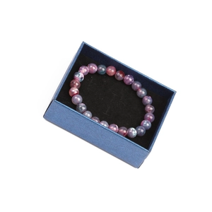 Colorful beaded bracelet set in a deep blue textured gift box with black velvet lining