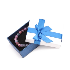 Elegant beaded bracelet in blue textured gift box with a silk ribbon bow and velvet lining