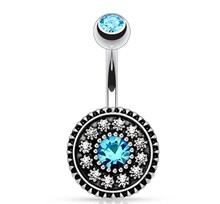 Detail of silver belly ring with a large blue gem and sparkling clear crystals