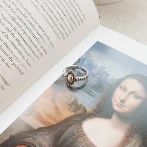 Macro shot of S925 sterling silver vintage ring with oval metal face and beaded frame