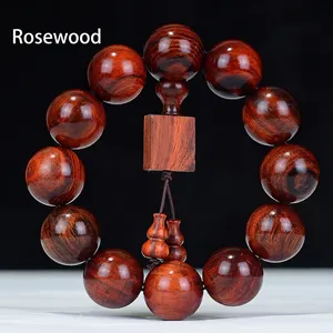 Bracelet en bois de rose poli avec douze perles rondes et pendentifs calebasse