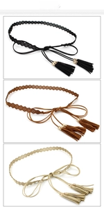 Detailed view of hollow patterned belts with elegant tassels in black, brown, and beige