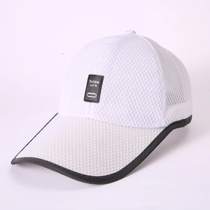 Close-up of white breathable mesh baseball cap with black rectangular logo label