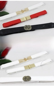 Detail view of thin elastic waist belts for women in black, red, and white faux leather