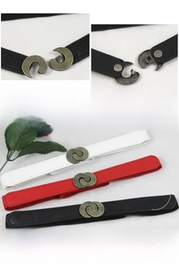 Detail of vintage elastic waist belts in black, white, and red with metal hook buckles