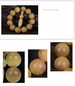 Detailed view of handmade unvarnished natural dragon blood bamboo beads with spotted texture