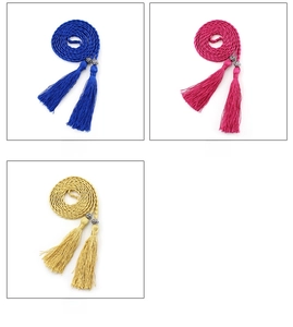Detail view of woven waist ropes with tassel ends in royal blue, rose red and gold colors