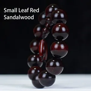 Polished high-density sandalwood bead bracelet with visible golden star grain textures