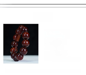 Detailed view of polished blood sandalwood beads with natural grain and 2.0cm diameter