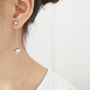 925 Sterling silver long tassel ball drop earrings shown on a model for a stylish look