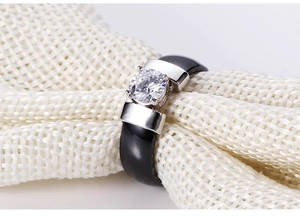 Macro view of 6mm black ceramic ring with silver setting and sparkling cubic zirconia
