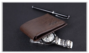 Close-up of dark brown leather wallet with lychee texture next to a watch and pen