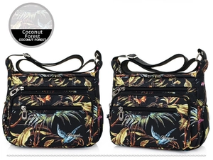 Detail of tropical print nylon crossbody bag with multi-pocket design and coconut forest pattern
