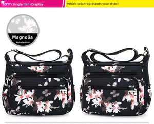 Detail view of water-resistant nylon shoulder bag with magnolia and butterfly prints