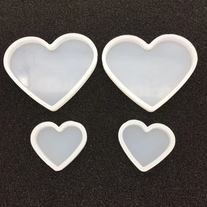 Macro view of heart-shaped silicone molds for DIY resin casting and jewelry making