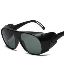 Side view of black wraparound cycling sunglasses featuring dark grey protective lenses