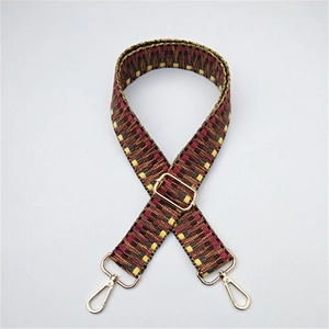 Adjustable woven shoulder strap with red and yellow geometric patterns and gold clips