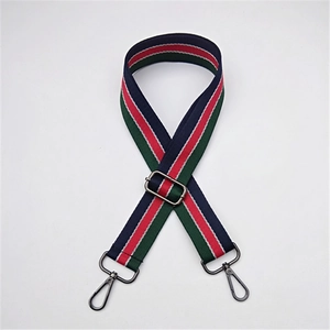 Detail of adjustable striped webbing shoulder strap with high-quality metal hardware