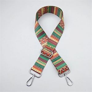 Detail of adjustable woven shoulder strap with colorful ethnic patterns and silver hooks