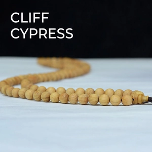Handcrafted 108 cliff cypress wood prayer beads with natural grain and polished finish