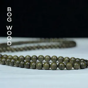 Polished Bogwood prayer beads bracelet with 108 dark green natural wood grain beads