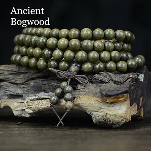Authentic bogwood Buddhist prayer beads 108 pieces on natural weathered wood backdrop