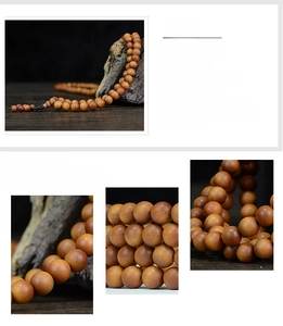 Macro shot of 108 natural sandalwood beads showing detailed wood grain and texture
