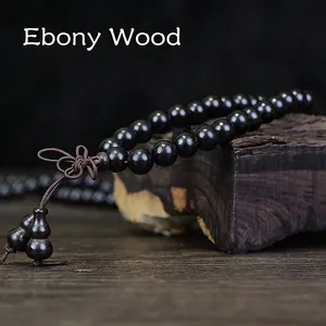 Polished ebony wood Buddhist prayer beads with Chinese knot and small gourd charms