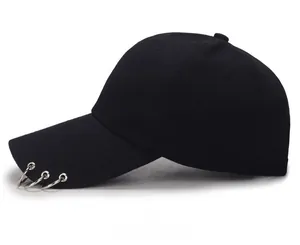 Detailed side view of black cotton baseball cap with three decorative silver metal rings